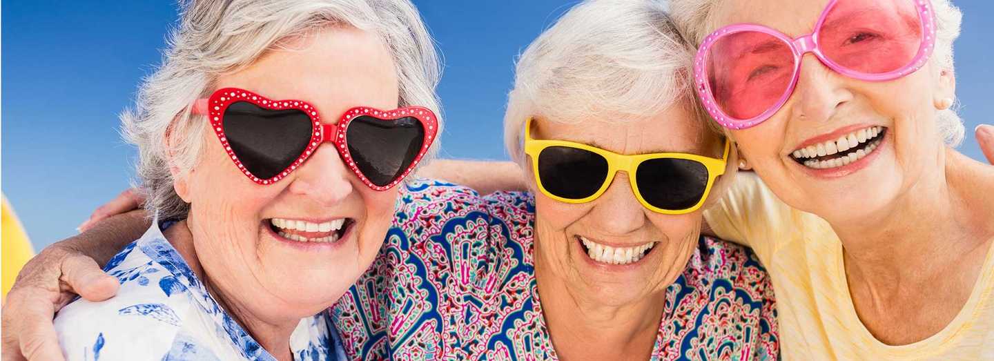 Smiling seniors wearing sunglasses